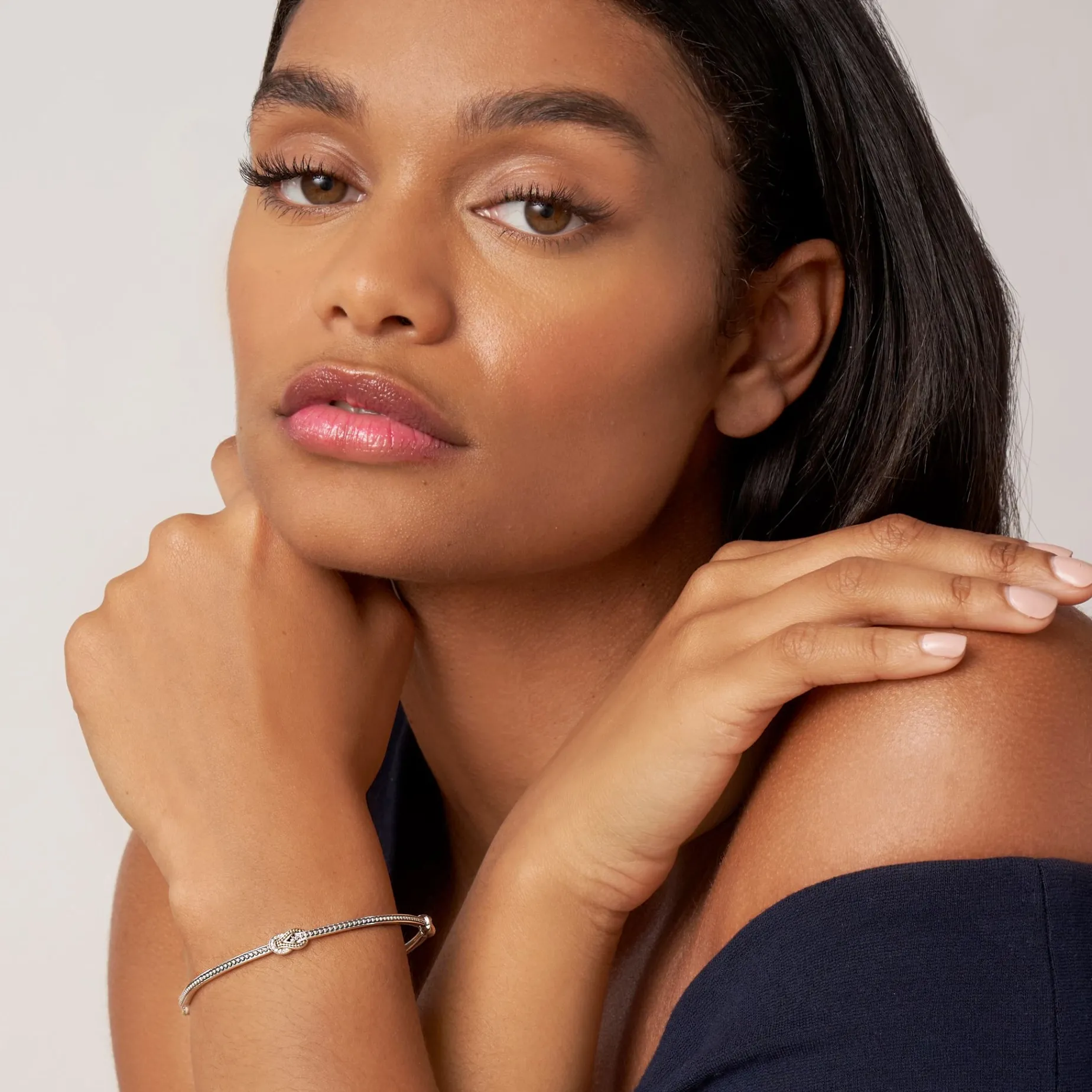 Four Station Two-Tone Knot Diamond Bangle Bracelet